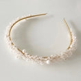 Load image into Gallery viewer, Gold headband with pearls on a light gray background