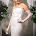 Load image into Gallery viewer, Woman wearing a white strapless dress and lace bridal gloves with a neutral background