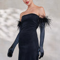 Load image into Gallery viewer, Black strapless dress with feathered shoulders and black opera satin gloves with ostrich feather cuff
