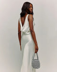 Load image into Gallery viewer, bride wearing hive metallic bridal handbag in silver