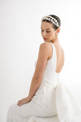 Load image into Gallery viewer, Woman wearing a white dress and floral headband on a white background