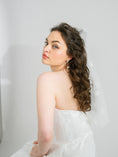 Load image into Gallery viewer, Woman in a white dress with a plain background