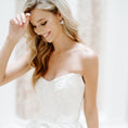 Load image into Gallery viewer, Woman wearing a white strapless dress against a plain background