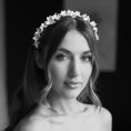 Load image into Gallery viewer, Black and white portrait of a bride wearing a floral headband.