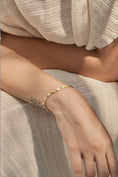 Load image into Gallery viewer, woman wearing gold bracelet