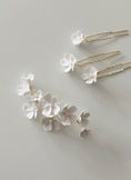 Load image into Gallery viewer, Floral hairpins on a light gray background