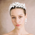 Load image into Gallery viewer, Woman wearing a floral headpiece against a neutral background