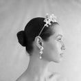 Load image into Gallery viewer, Black and white portrait of a woman wearing a floral headpiece and earrings.