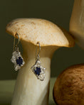 Load image into Gallery viewer, Silver earrings with sapphire on a wooden mushroom