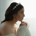 Load image into Gallery viewer, Woman wearing a floral headband and white off-shoulder top against a bright background