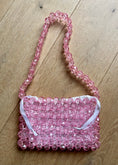 Load image into Gallery viewer, Pink beaded bridal handbag on a wooden surface