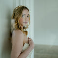 Load image into Gallery viewer, Woman in a white dress standing against a neutral background