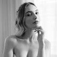 Load image into Gallery viewer, Black and white portrait of a woman with a soft focus background
