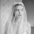 Load image into Gallery viewer, Black and white photo of a woman wearing a floral headband and veil.
