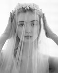 Load image into Gallery viewer, Black and white photo of a woman wearing a veil with floral accents.