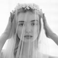 Load image into Gallery viewer, Black and white photo of a woman wearing a veil with floral accents.