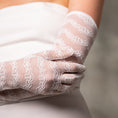 Load image into Gallery viewer, Close-up of a person wearing white lace gloves against a neutral background