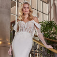 Load image into Gallery viewer, Woman in a white wedding dress with lace bridal gloves standing on a staircase.