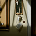Load image into Gallery viewer, Decorative shadow box with a candle on a wall with framed pictures with a bridal bag