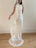 Load image into Gallery viewer, Model wearing White lace veil and wedding dress on a wooden floor with a plain white wall background