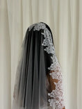 Load image into Gallery viewer, Model wearing White lace veil and wedding dress with a plain white wall background