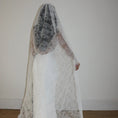 Charger l'image dans la visionneuse de la galerie, Woman wearing a white lace veil and wedding dress against a white background