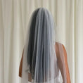 Charger l'image dans la visionneuse de la galerie, Person wearing a white wedding dress with a long plain veil against a plain background