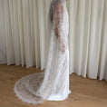 Charger l'image dans la visionneuse de la galerie, Woman wearing a white lace veil and wedding dress against a white background