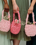 Load image into Gallery viewer, bridesmaids wearing hive bridal handbag in blossom