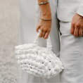 Load image into Gallery viewer, bride holding nest bridal handbag in bright white