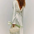 Load image into Gallery viewer, bride wearing nest bridal handbag in ivory