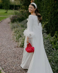 Load image into Gallery viewer, bride wearing nest bridal handbag in red and pink