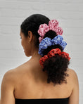 Load image into Gallery viewer, flower scrunchie in wisteria, red and pink
