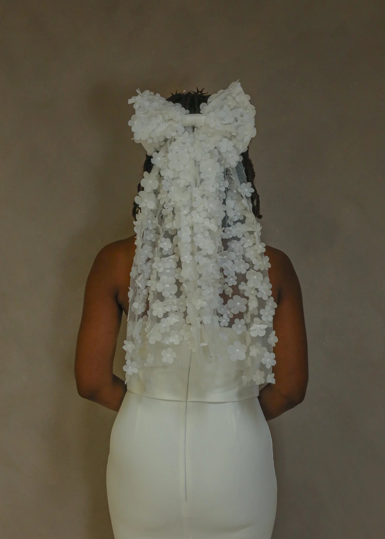 woman wearing hayze bridal hair bow
