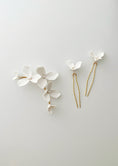 Load image into Gallery viewer, Set of floral hairpins on a light gray background
