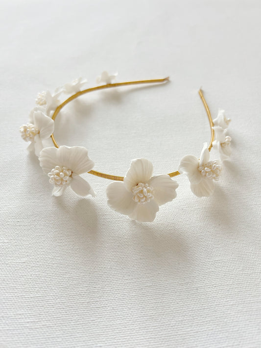Floral headband with white flowers on a light background