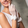 Load image into Gallery viewer, Woman wearing white gloves with bows, likely in a wedding setting

