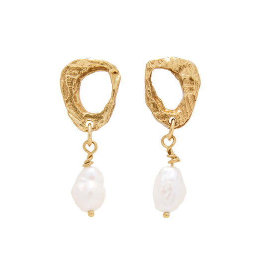 Gold earrings with pearl drops on a white background