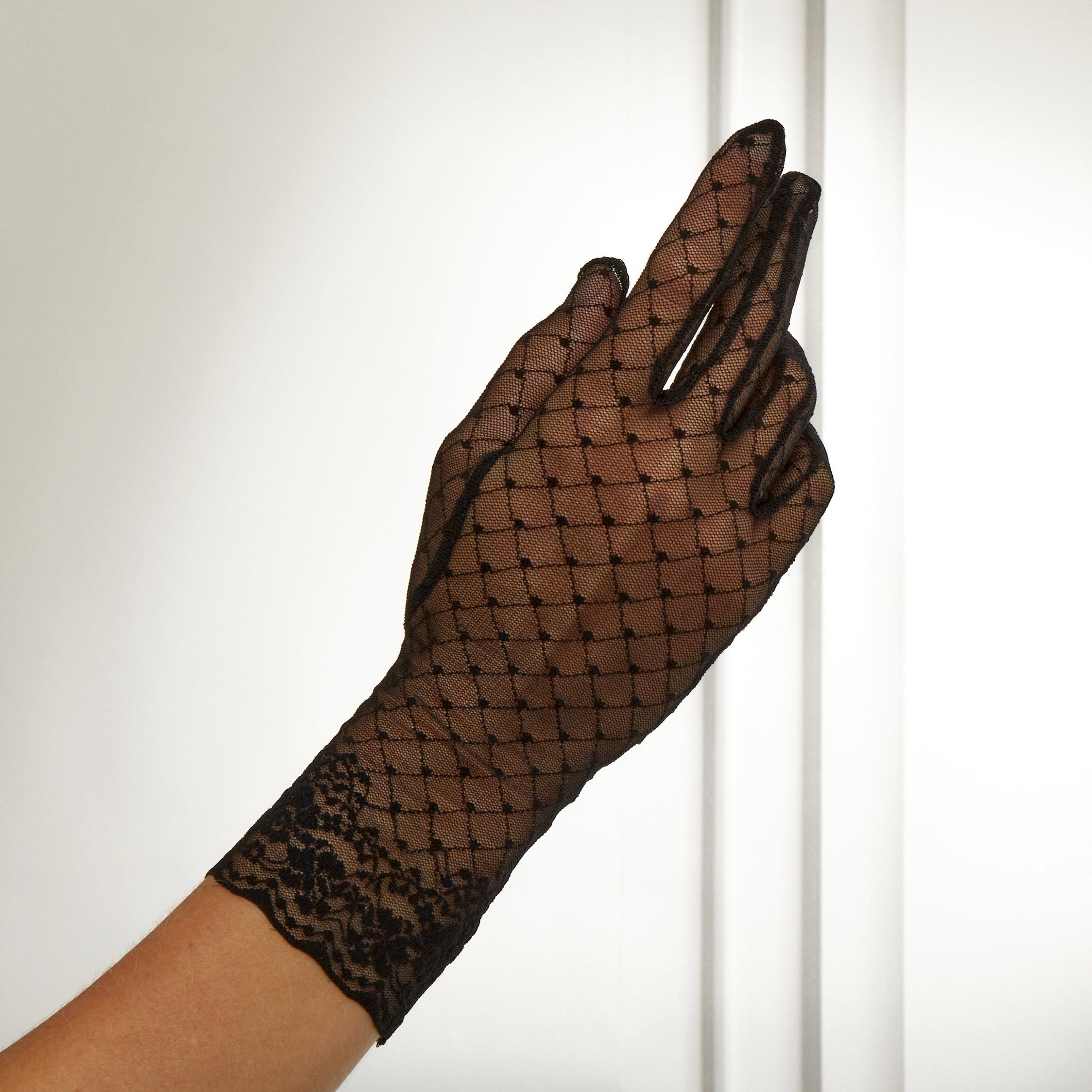 Cornelia James black bridal lace gloves on white background