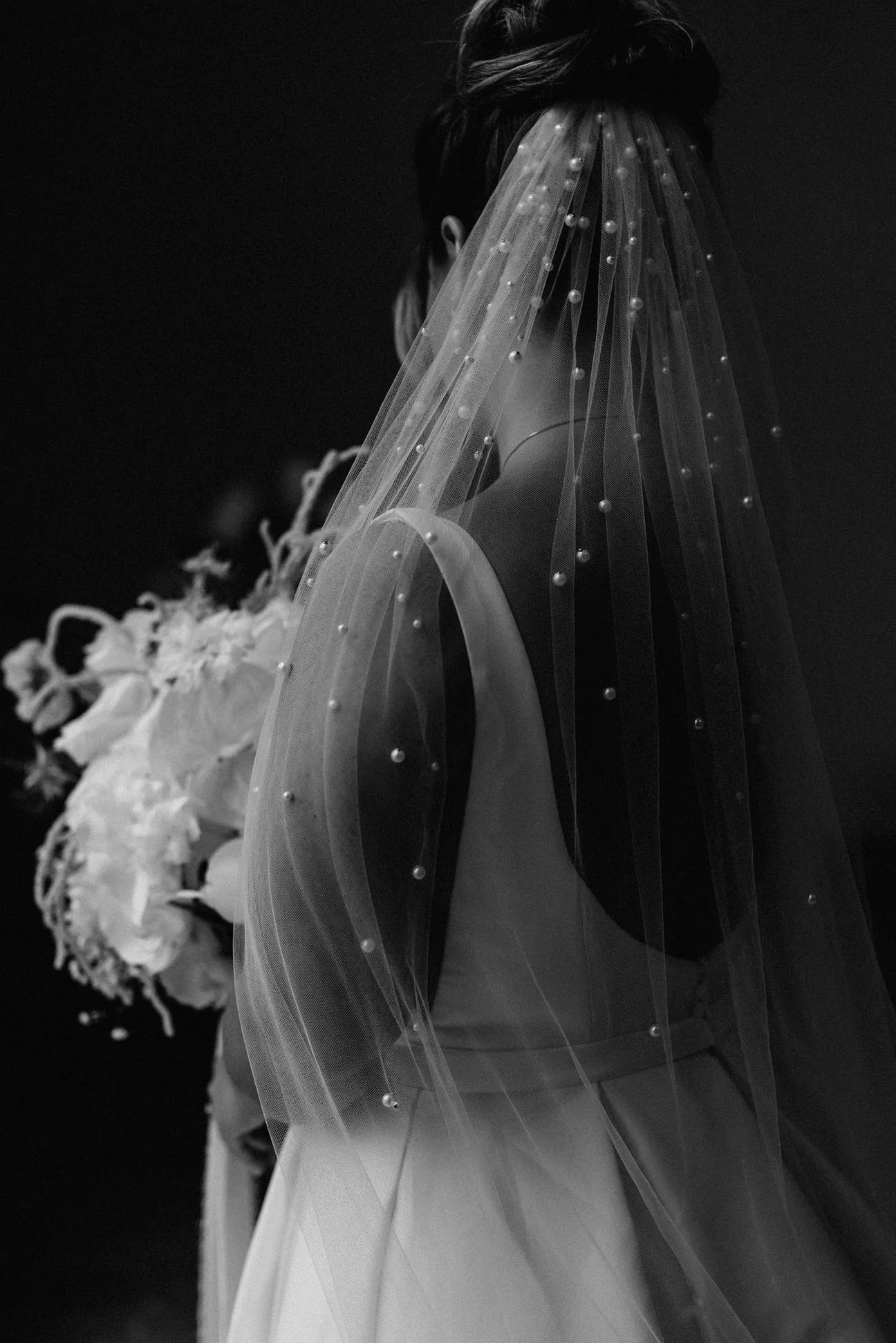 woman wearing hayze bridal pearl waterfall veil