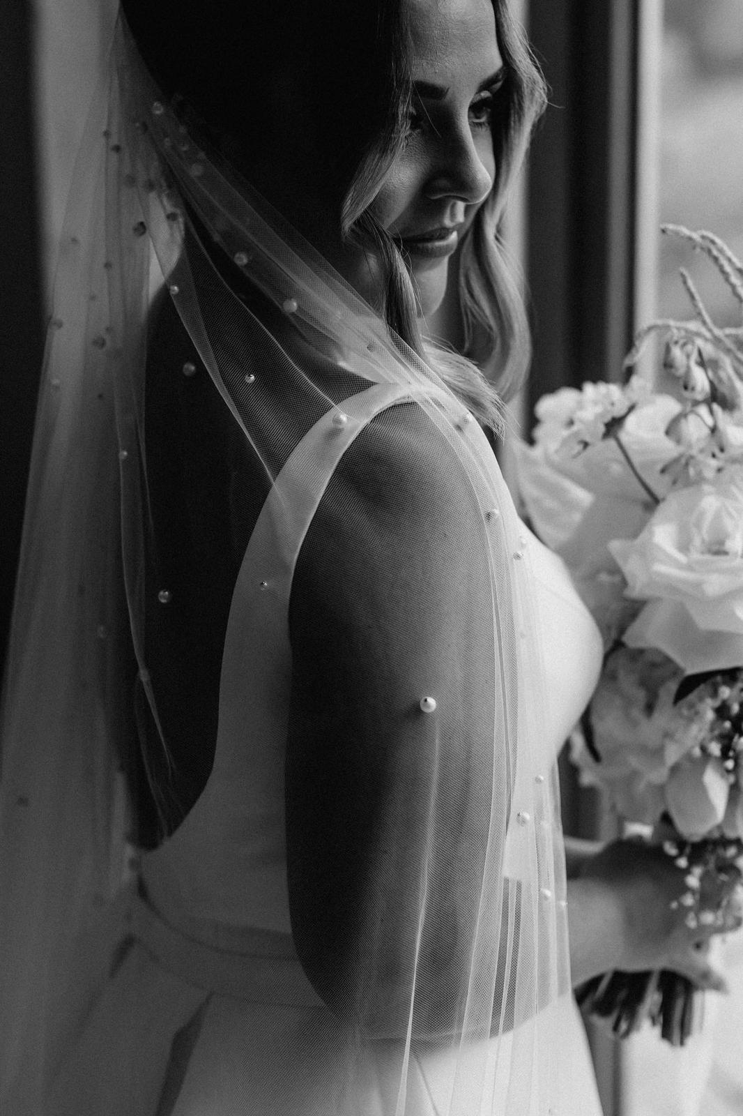 woman wearing hayze bridal pearl waterfall veil