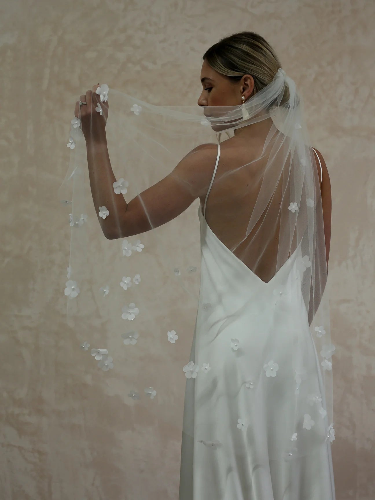 woman wearing hayze bridal petal veil