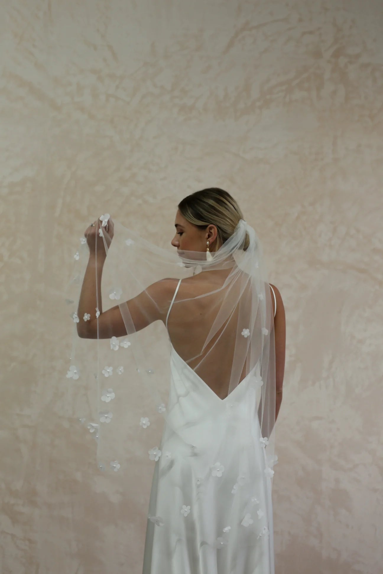 woman wearing hayze bridal petal veil