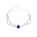 Load image into Gallery viewer, Silver bracelet with a sapphire on a white background
