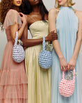 Load image into Gallery viewer, ladies wearing hive handbag in parma violet
