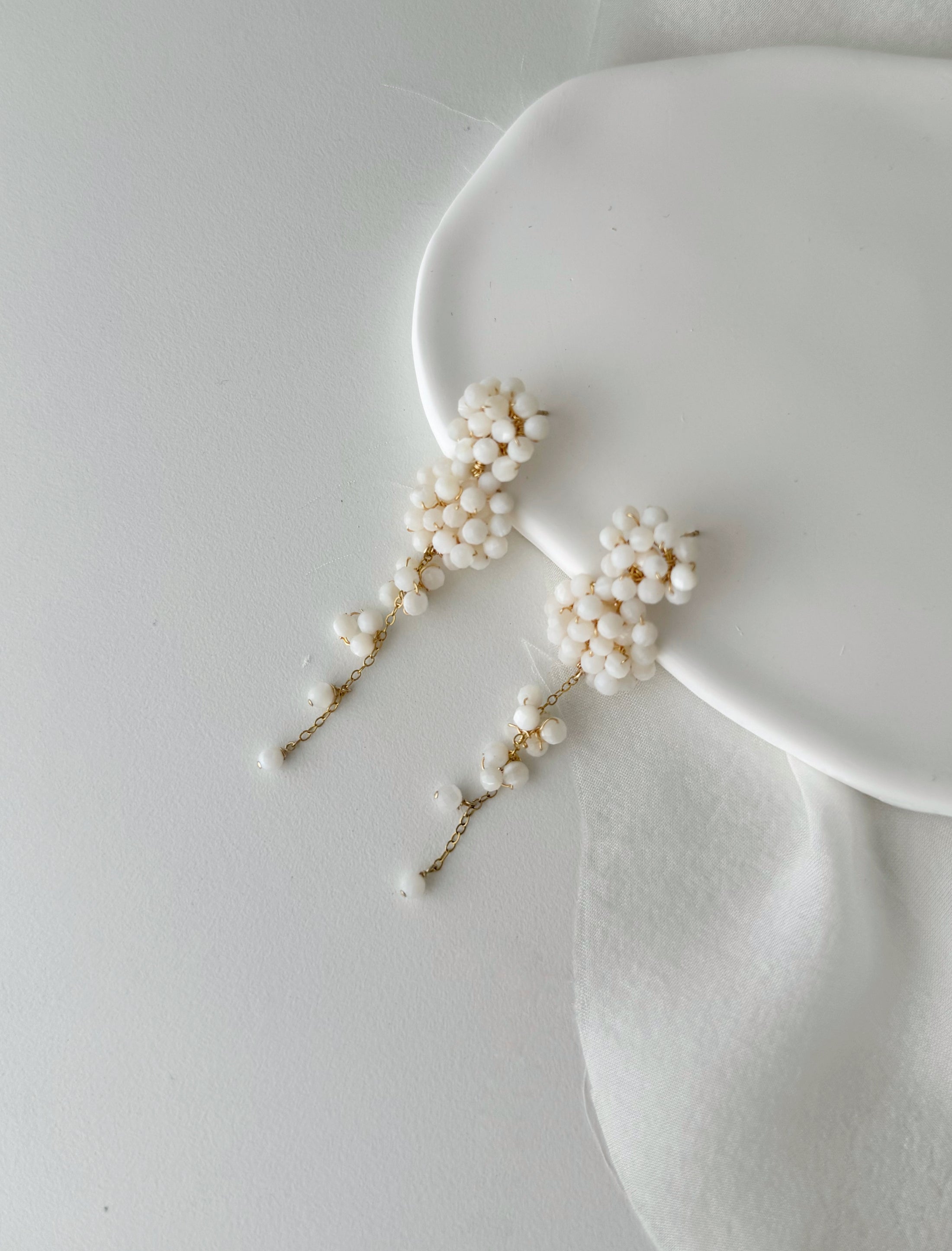 Pearl hairpins on a white surface