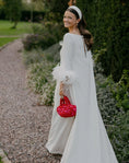 Load image into Gallery viewer, bride wearing nest handbag in red and pink
