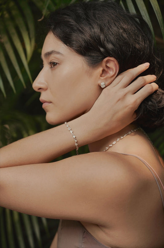 woman wearing silver bracelet and necklace