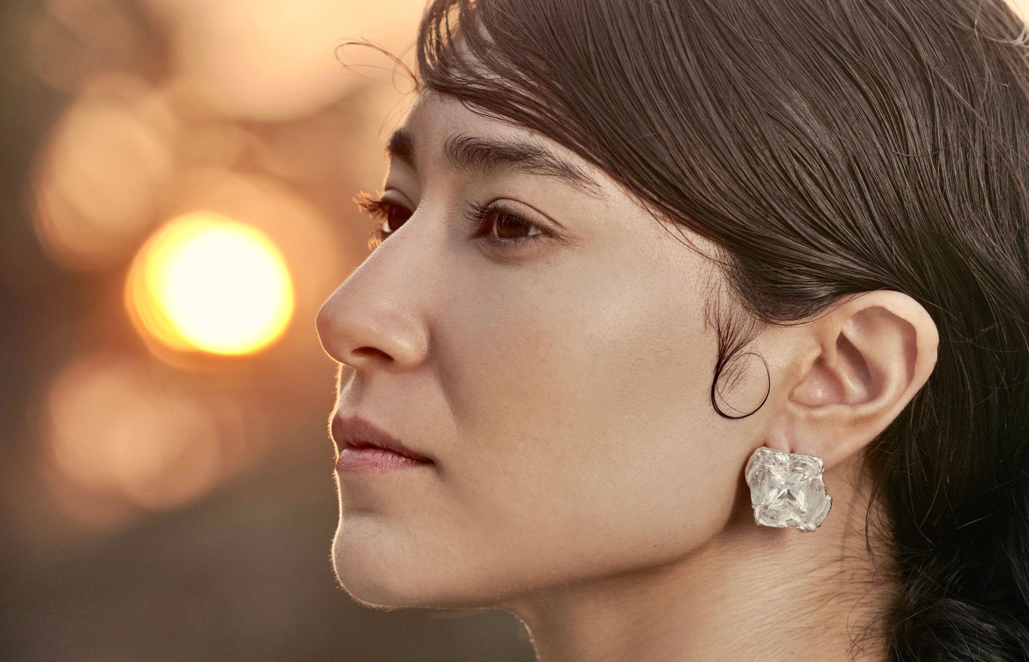 woman wearing silver earrings