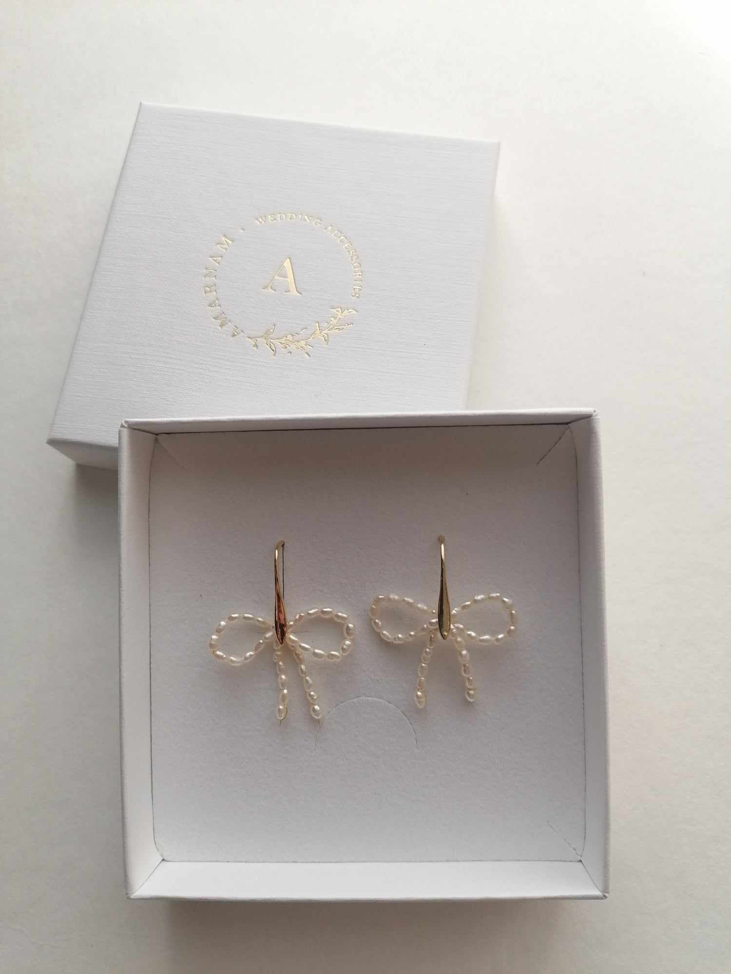 amarnam Indara Pearl bow Earrings 